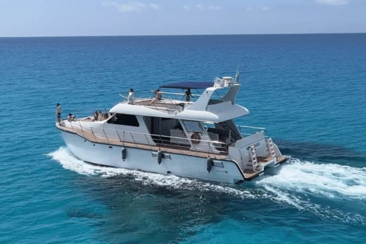 Catamaran cruising the open sea off the Cape Greco coast near Ayia Napa, Cyprus