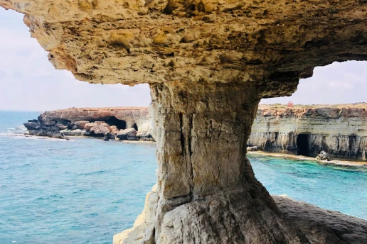 The mushroom rock formation above the Ayia Napa Sea Caves, seen from below near the water