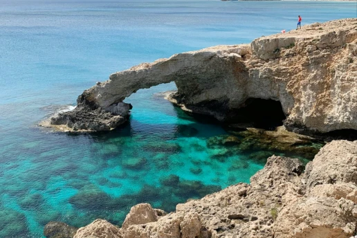 Love Bridge natural sea arch over turquoise water on the Cape Greco coastline near Ayia Napa