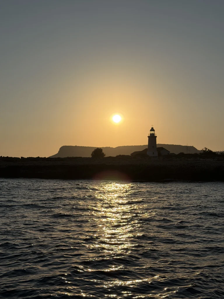 Scubacat catamaran anchored near Ayia Napa harbor at dusk